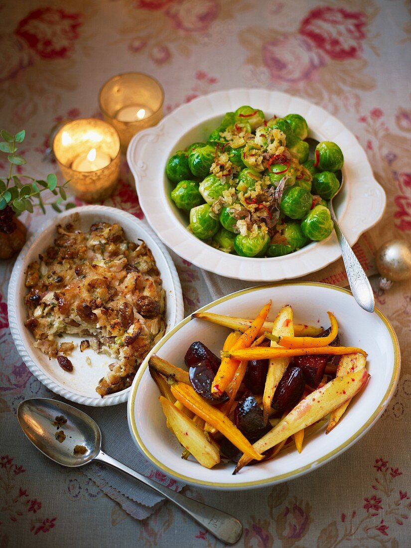 Christmas side dishes on an atmospheric Christmas table