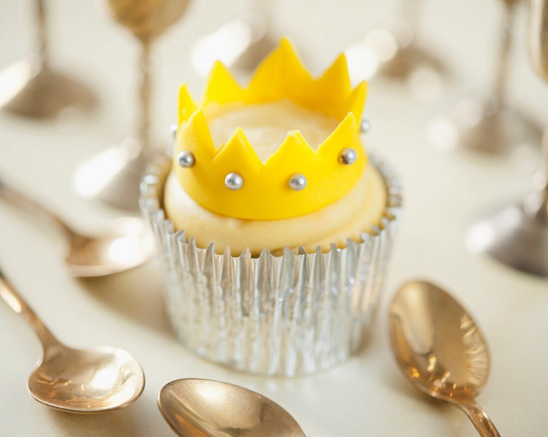 A cupcake decorated with a crown