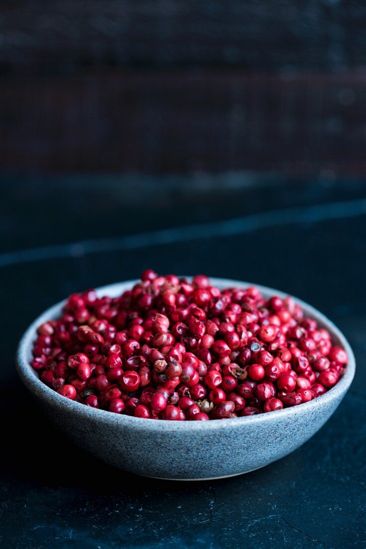 A bowl of pink peppercorns