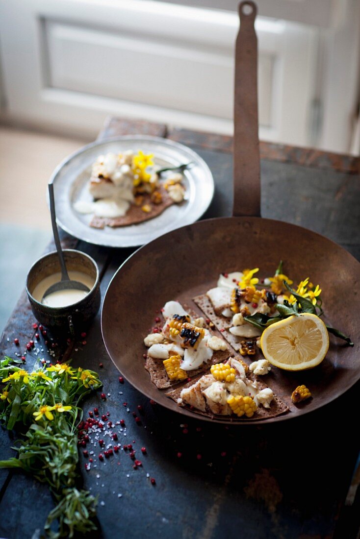 Buckwheat crepes with hake, grilled corn and cauliflower