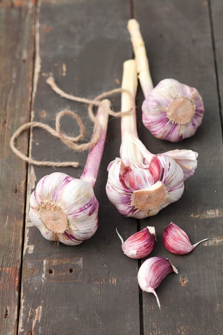 Bulbs of garlic on a rustic wooden table