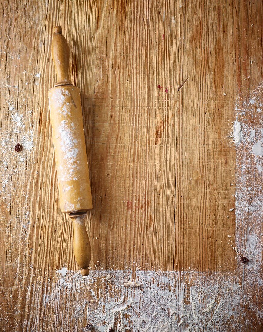 A floured wooden work surface and a rolling pin