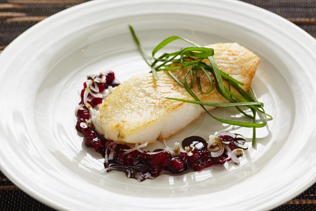 Halibut with a seed oil and lingonberry sauce