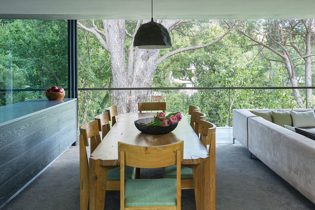 Oak dining set between kitchen counter and sofa combination