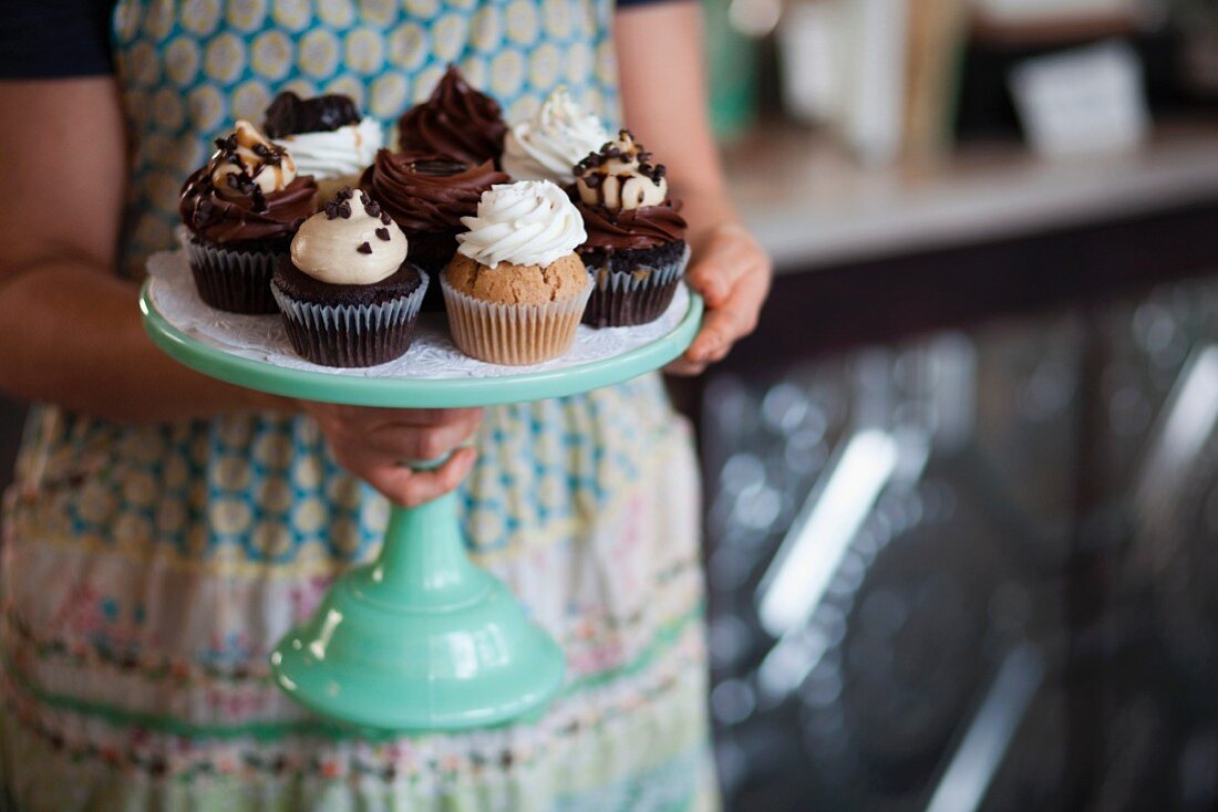Vegan cupcakes on a turquoise coloured cake stand