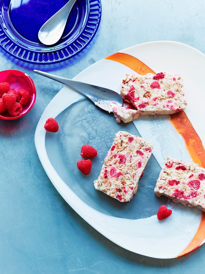 Three slices of masala fruit bread with raspberries