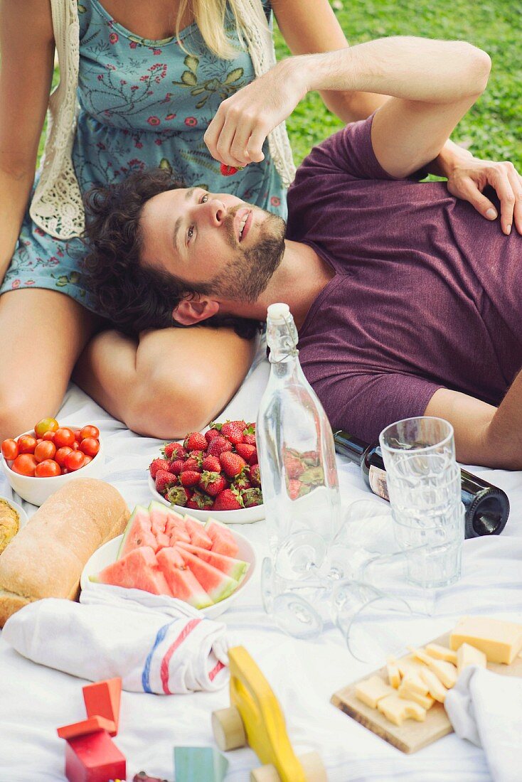A young couple having a picnic