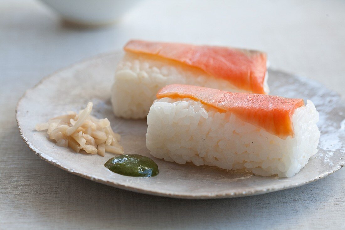 Salmon sushi with ginger and wasabi