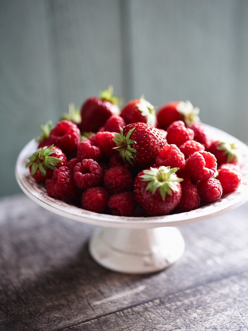 Fresh strawberries and raspberries in a bowl