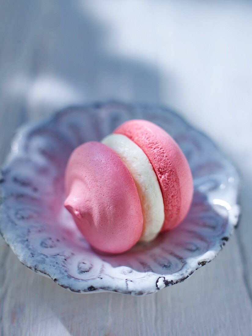 Pink meringue filled with cream filling (close-up)