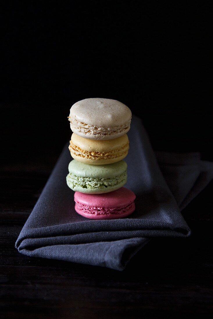 A stack of macaroons in four different colours