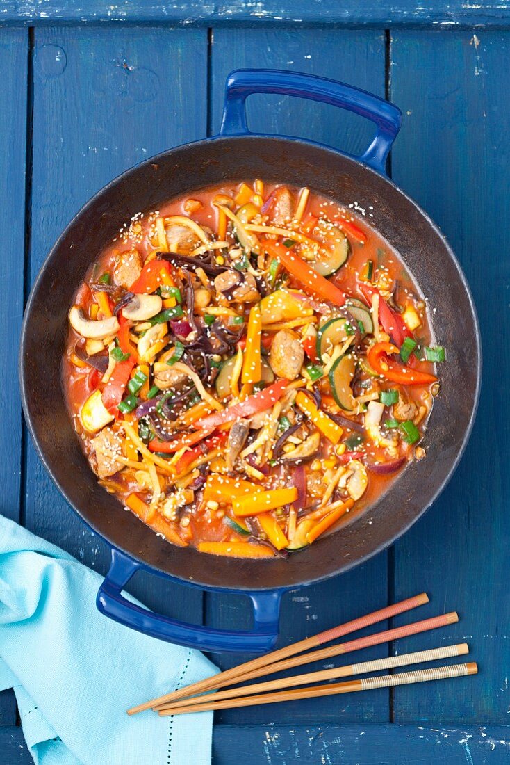 Sweet and sour pork with vegetables and mushrooms
