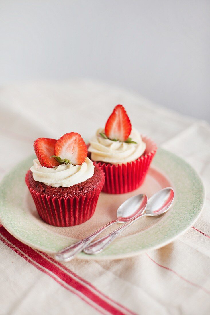 Strawberry muffins decorated with cream