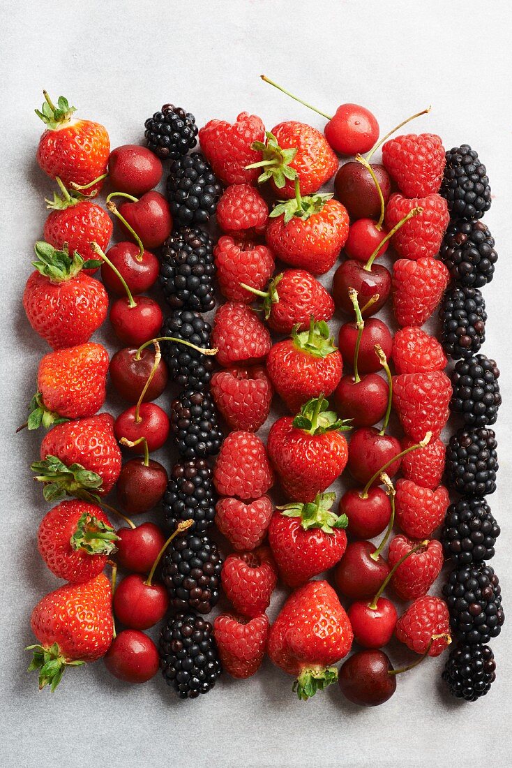 Summer fruits on a white surface