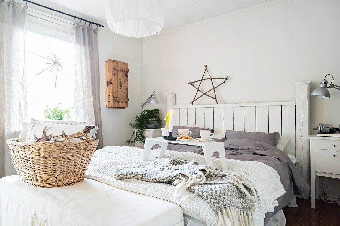 Breakfast tray in cosy, wintry bedroom