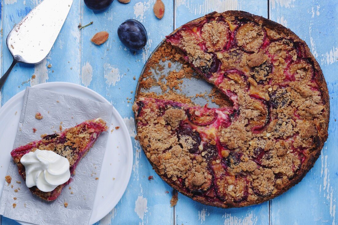 Plum crumble cake with whipped cream
