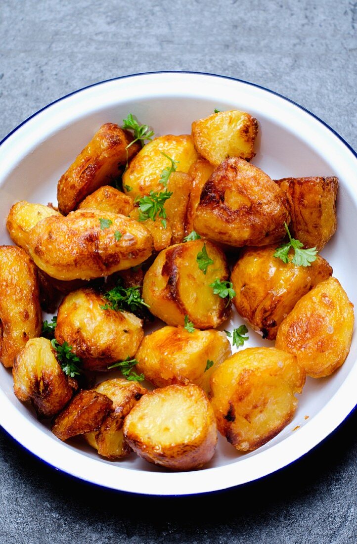 Roast potatoes in an enamel bowl