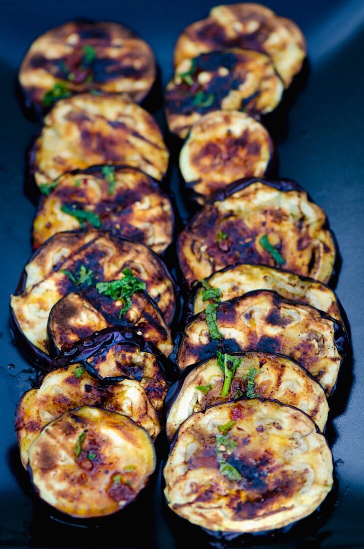 Grilled aubergine slices with chilli and mint