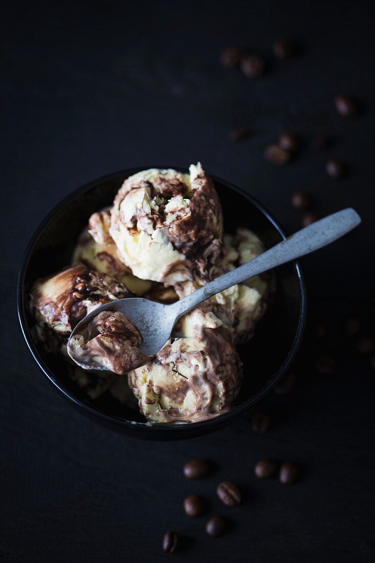Tiramisu ice cream in a bowl with a spoon