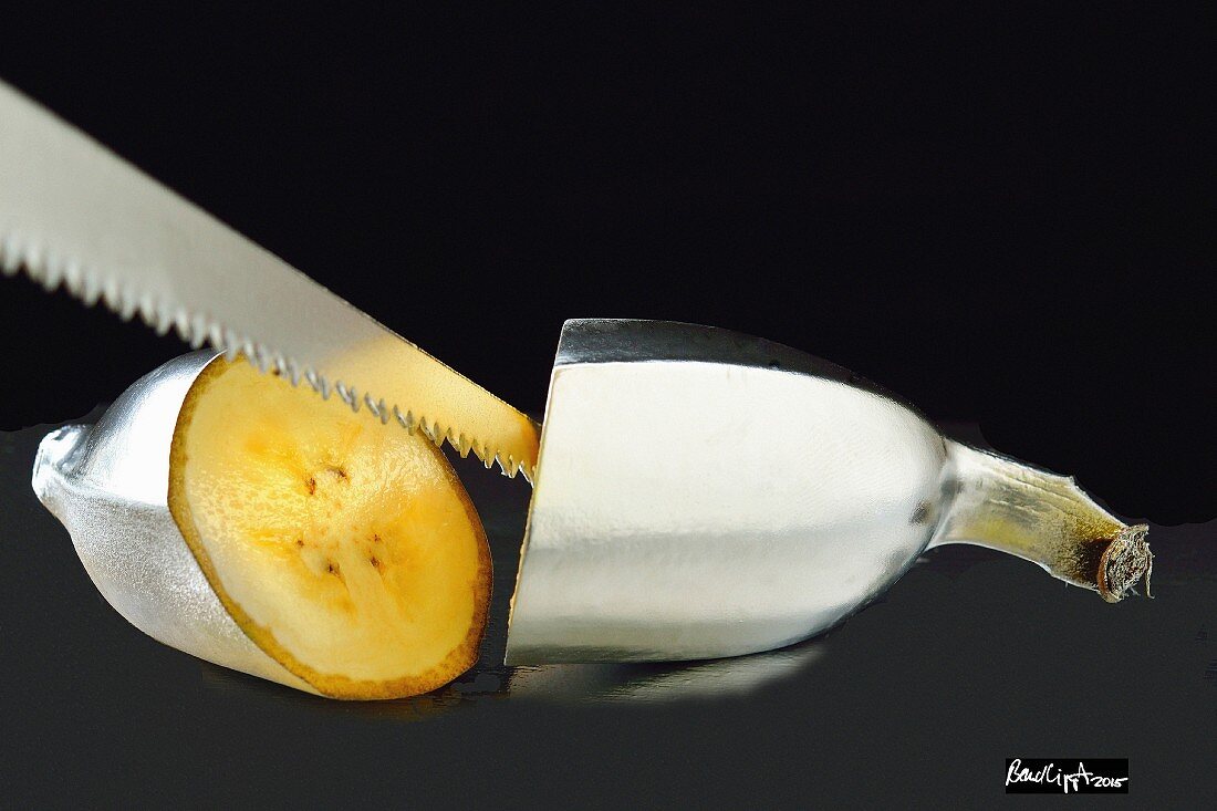 A silver banana with a saw