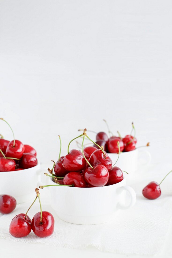 Fresh cherries in white cups