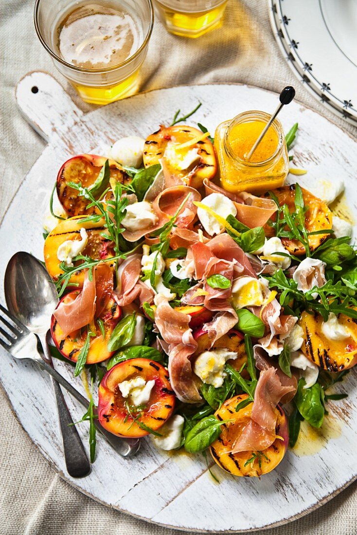 A salad with Prosciutto, grilled nectarines and bocconcini mozzarella