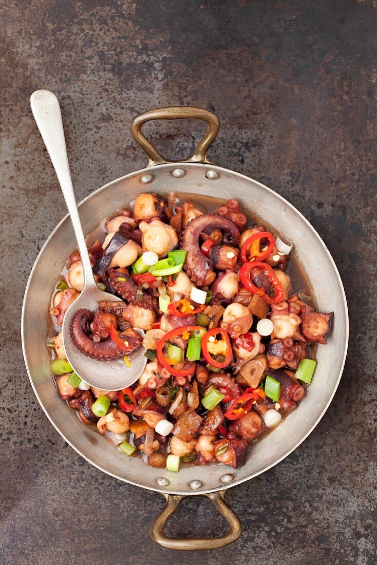 Fried octopus with ginger, chilli and spring onions