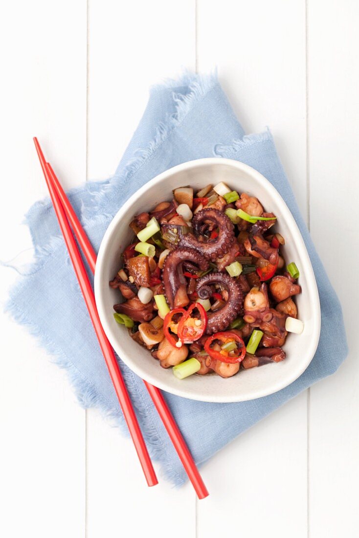 Fried octopus with ginger, chilli and spring onions