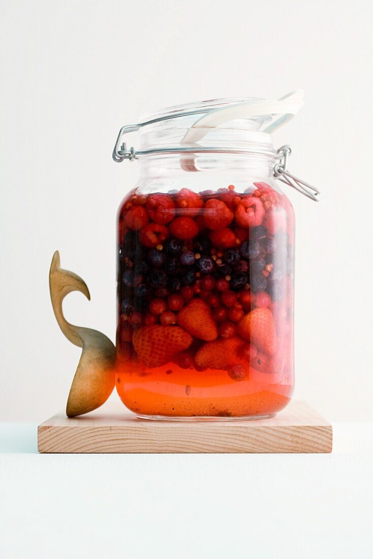 A jar of berries preserved in rum