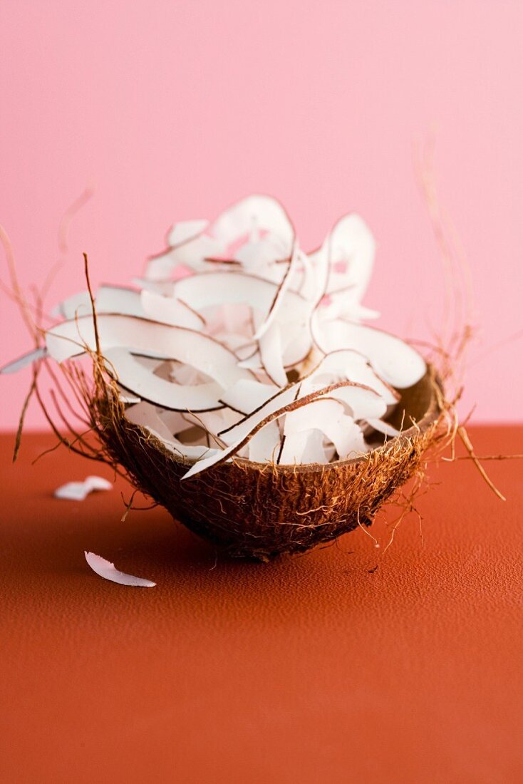 Grated coconut in a coconut half