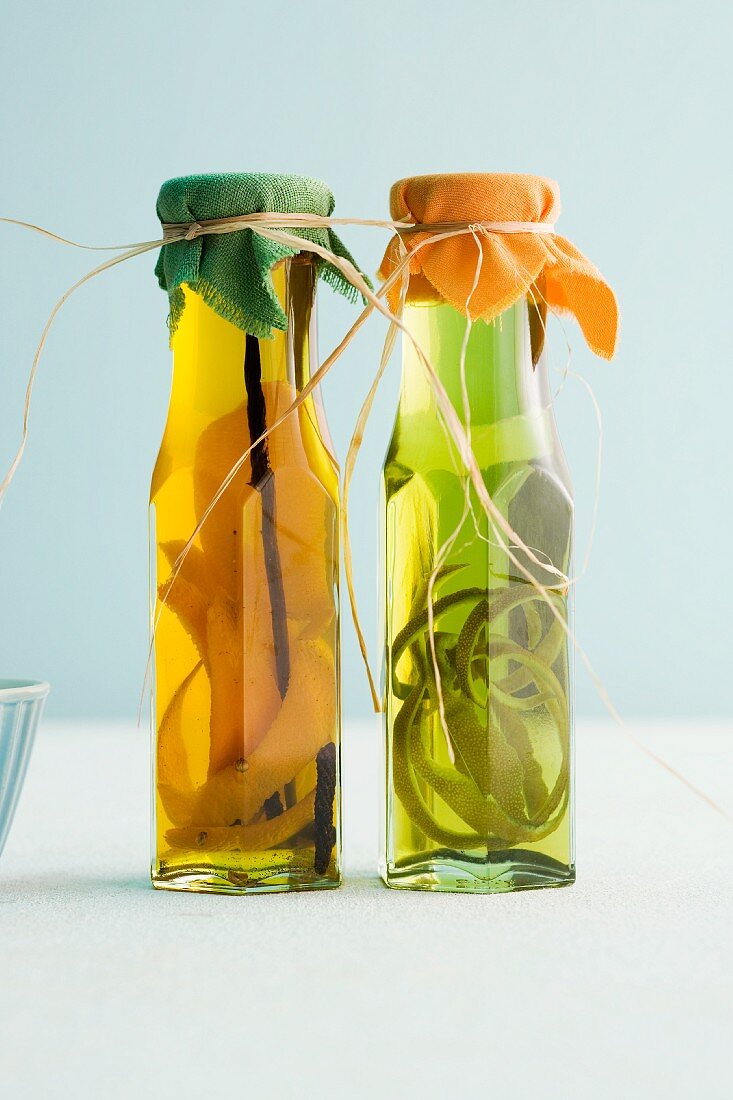 Bottles of homemade orange oil and herb oil