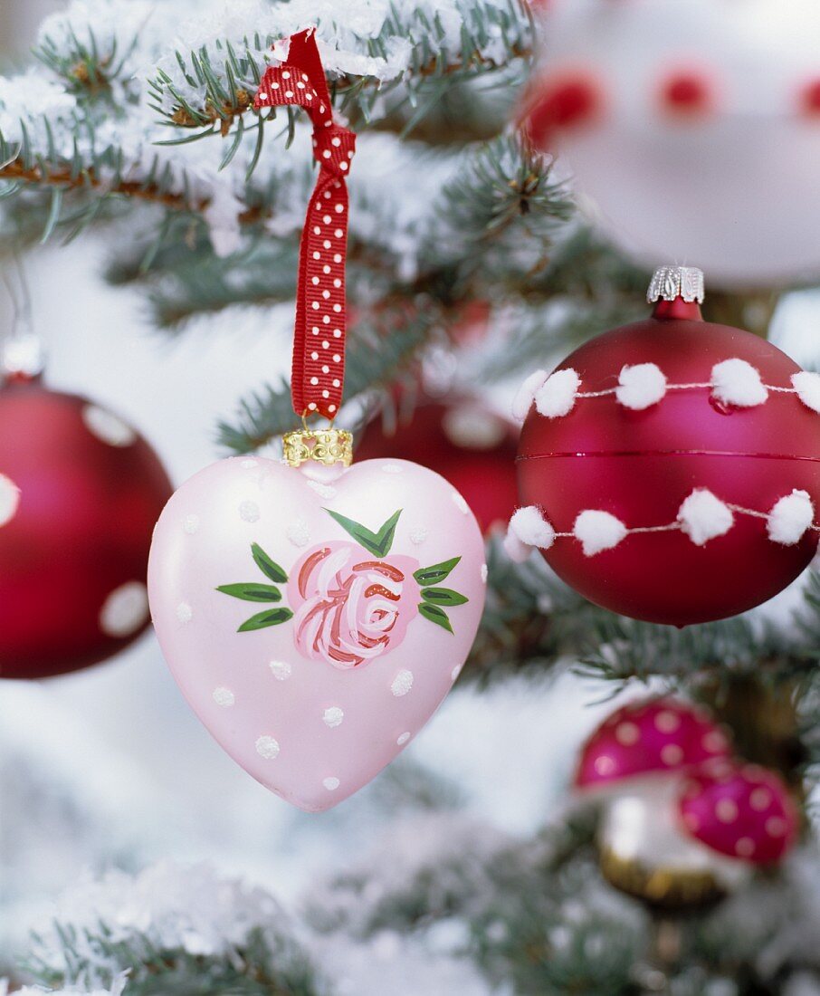 Vintage-style, hand-painted and decorated red and pink Christmas tree baubles