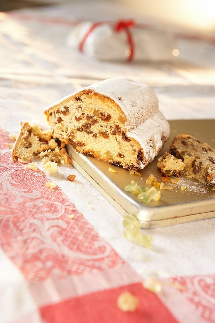 Stollen with icing sugar, sliced