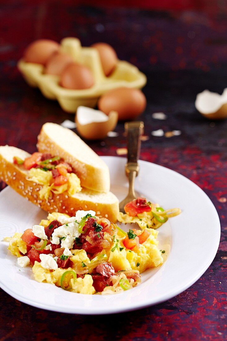 Menemen (Turkish scrambled eggs) with garlic sausage, chilli peppers and sheep's cheese