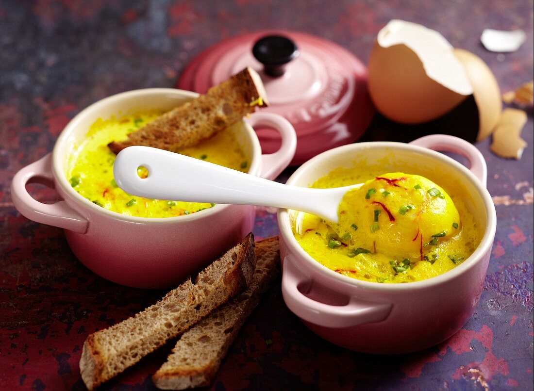 Oeufs cocotte with saffron and bread soldiers