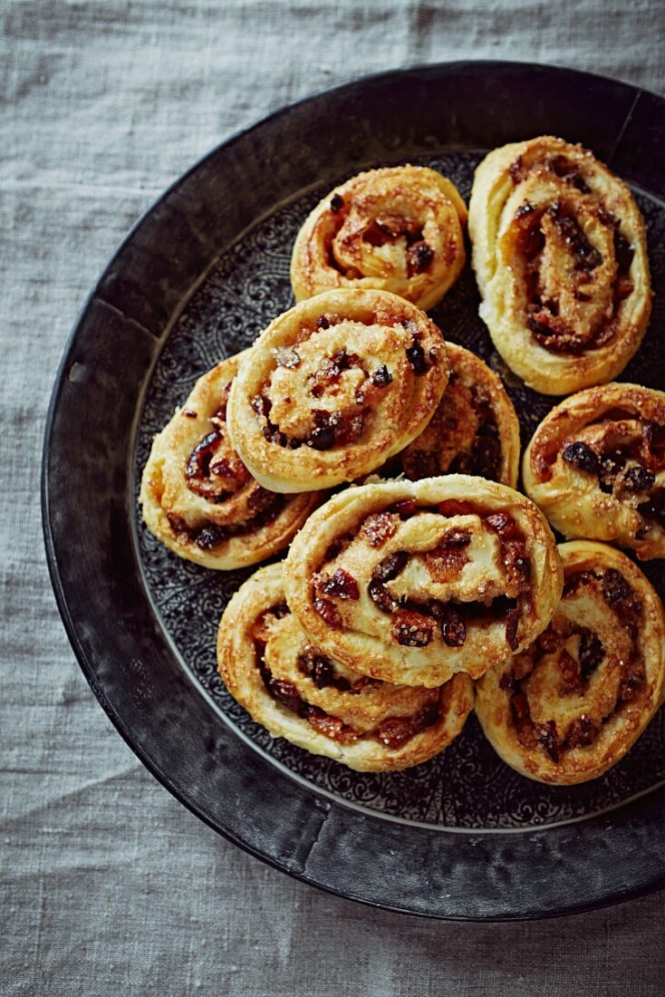 Freshly baked Christmas buns with dried fruit and spices