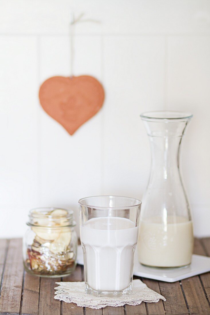 Vegan milk in a glass and a carafe