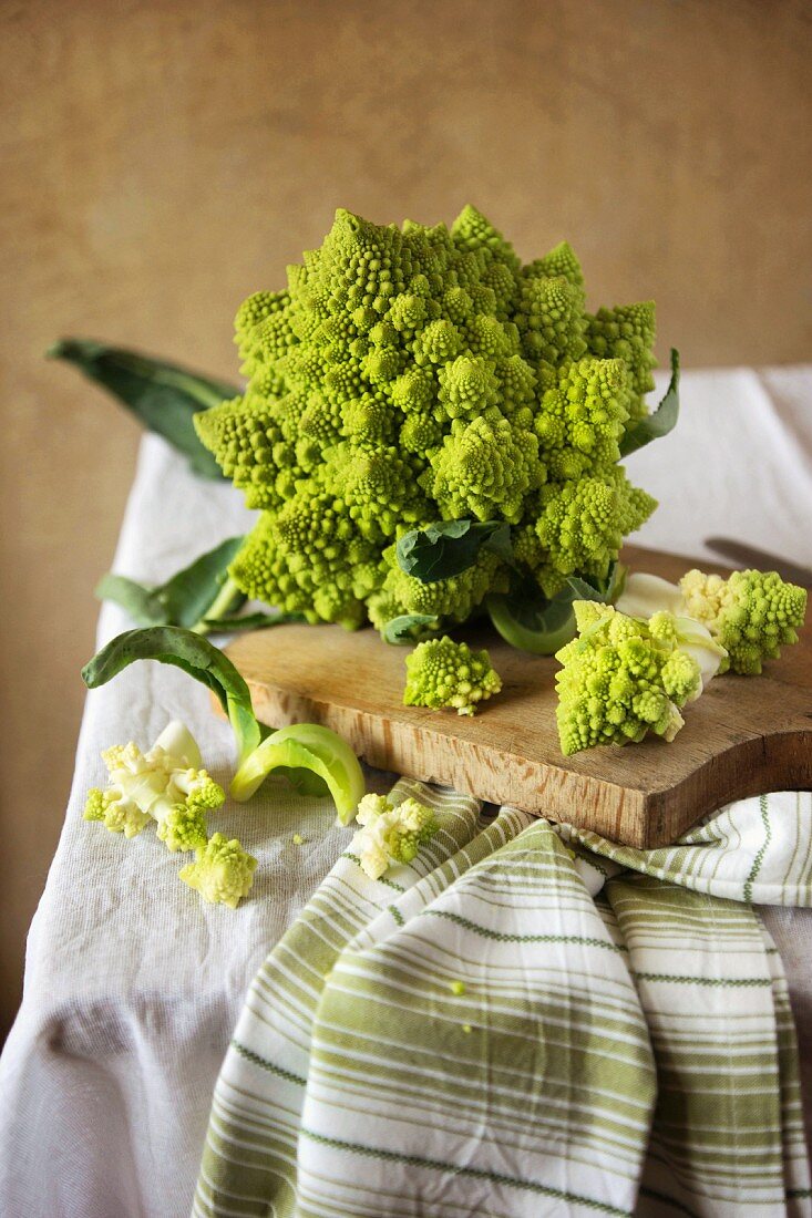 Fresh Romanesco broccoli on a wooden board