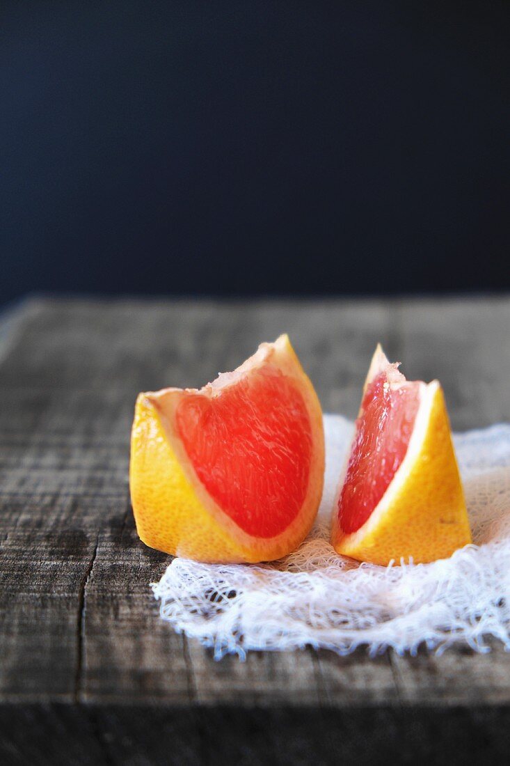 Two slices of pink grapefruit