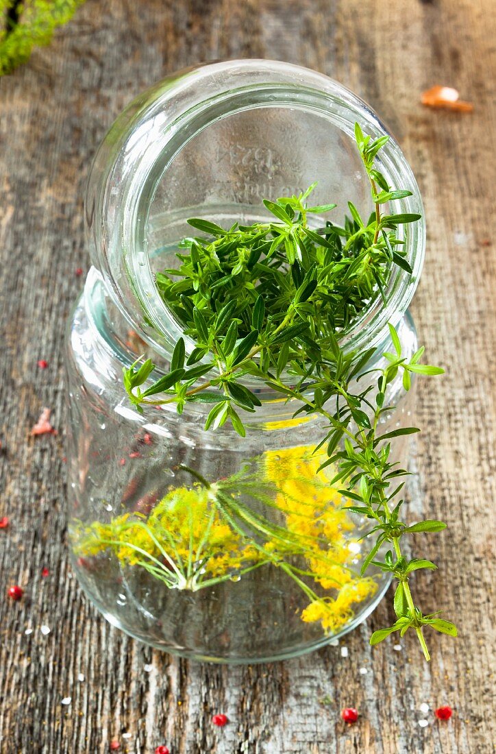 A gherkin jar filled with herbs