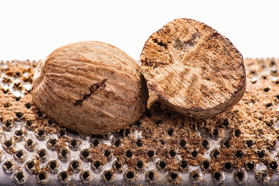 Nutmegs on a grater (close-up)