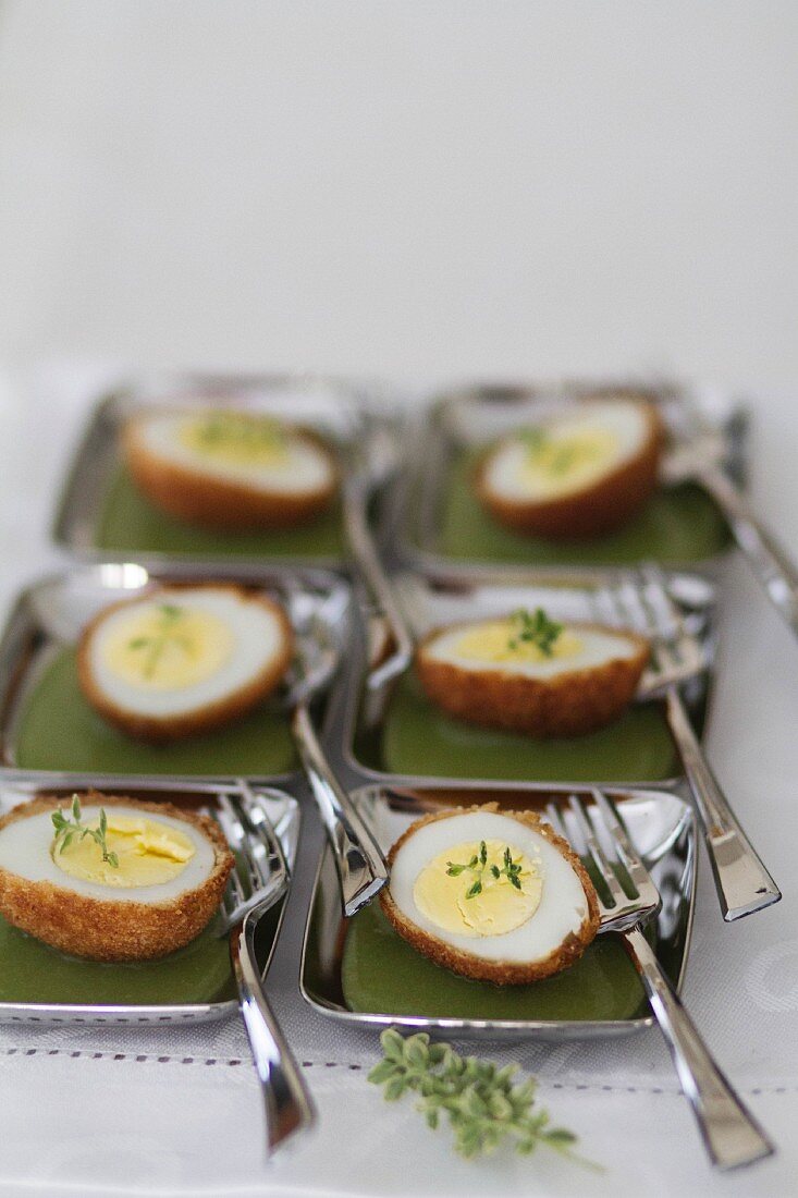 Fried quail's eggs on a pea sauce