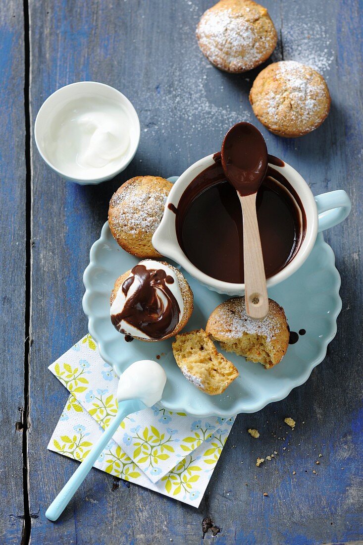 Pumpkin muffins with cream and chocolate sauce