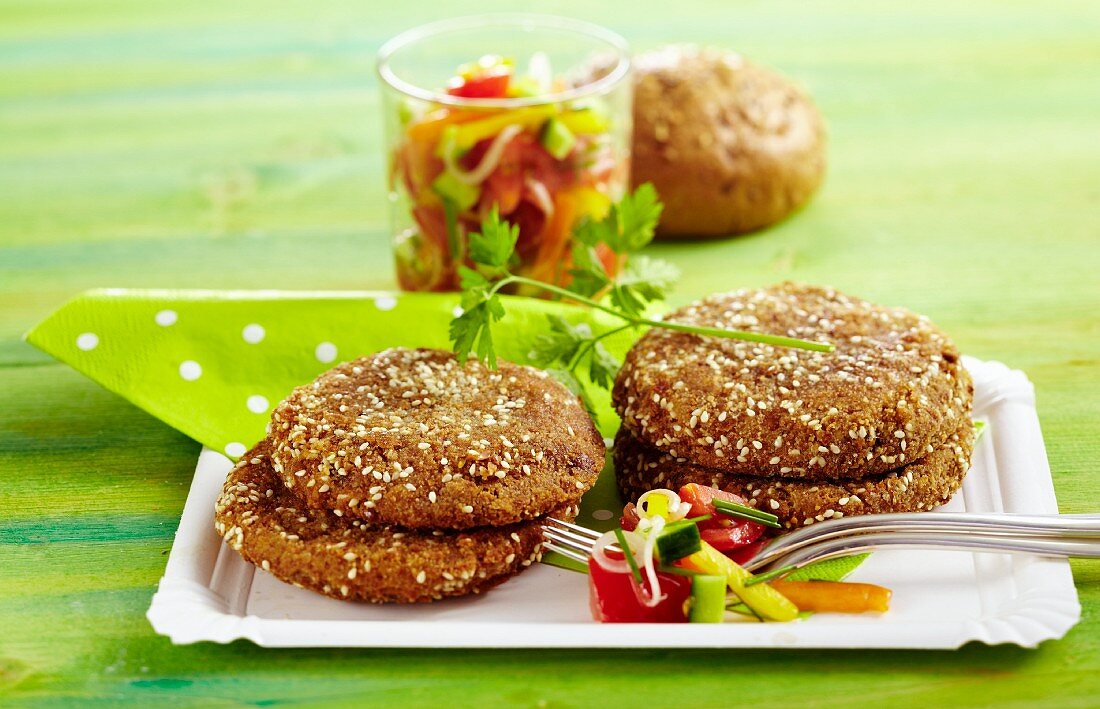 Fried sesame seed rolls with vegetable salad