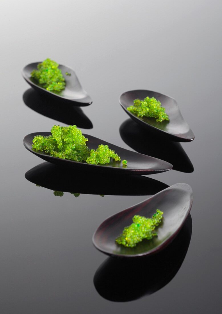 Green tobiko caviar from flying fish in shells