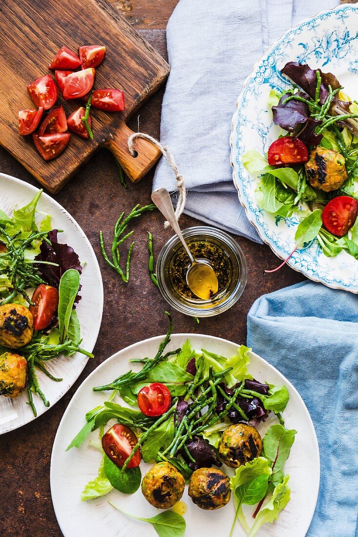 A salad with black tomatoes, samphire and vegetarian meatballs