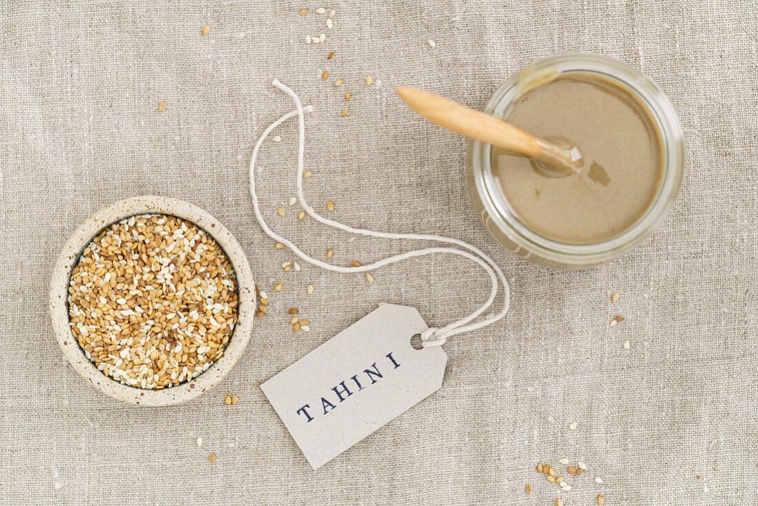 A jar of tahini (sesame seed paste), seen from above