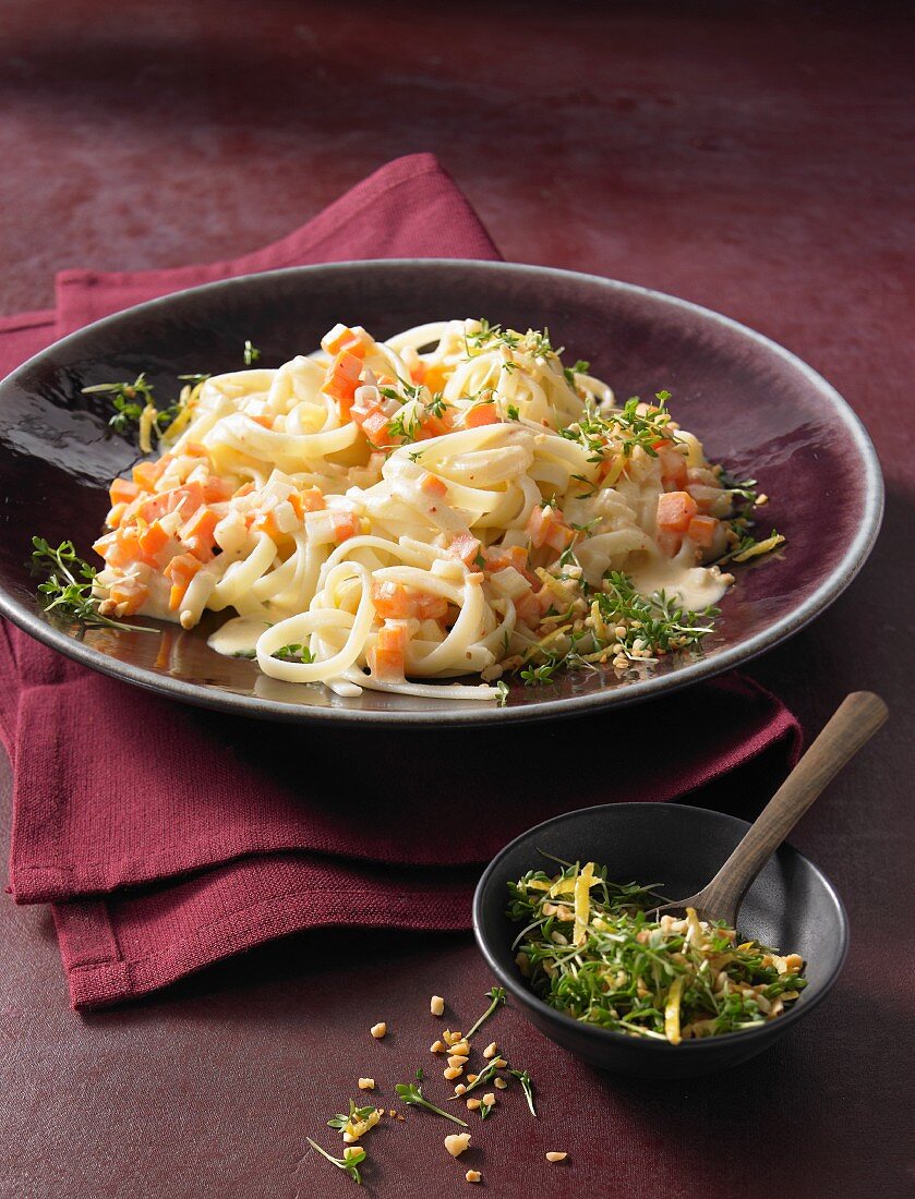 Carrot and celery noodles with cress and almond gremolata