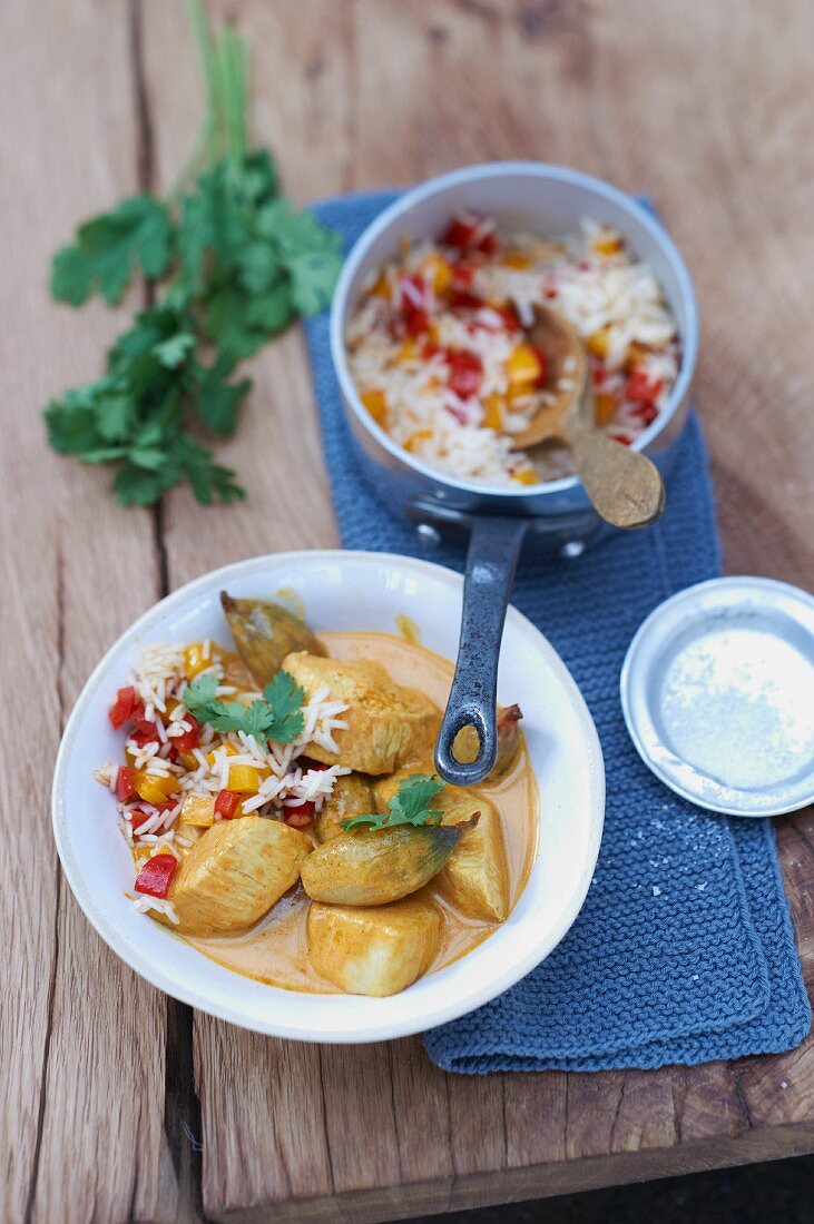 Turkey goulash in a red coconut curry sauce with pepper and basmati rice