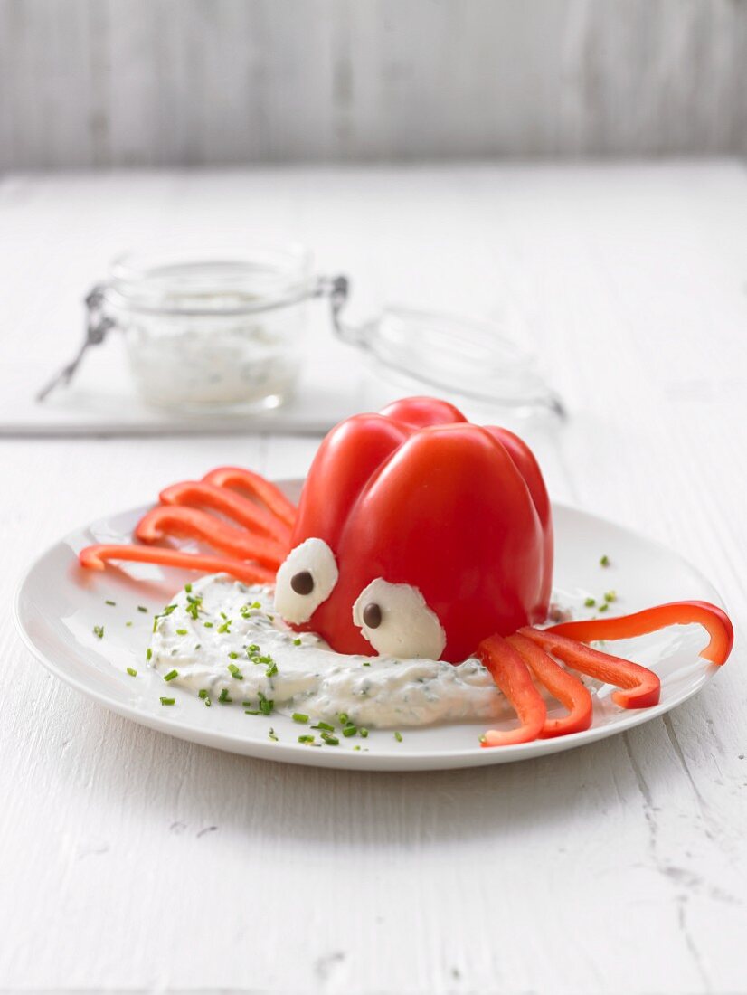 A vegetable octopus with a dip